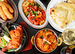 本場の名店を渡り歩いたシェフが作る本格インド料理。高温の窯で焼きあげるナンやタンドリーチキンは、いつでも焼き立て熱々。ご注文ごとにひと釜ずつ炊き上げるビリヤニは唯一無二の製法。極上の香りと味わいをぜひ。

ご予算の目安：【昼】1,500円～／【夜】2,500円～

・宴会・パーティ承ります
・アルコールメニューがあります
・お子様用の椅子があります
・電話ご予約できます